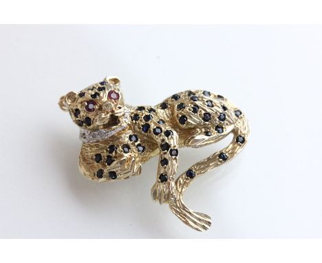 9ct Gold Wild Cat brooch with Sapphire spots, Ruby eyes and a Diamond collar