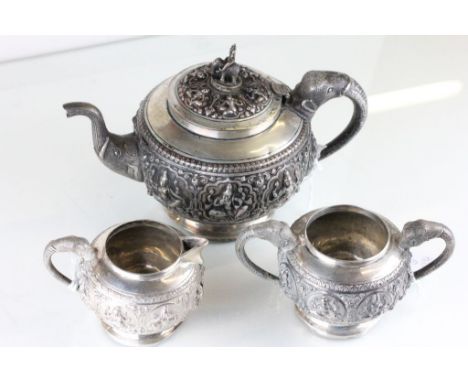 An Indian three piece tea service, embossed with deities