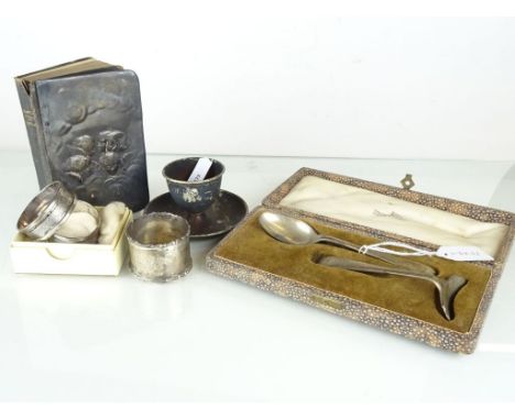  A silver childs pusher and spoon set, cased; a silver egg cup with a bowl base; a Common Book of Prayer with a silver cover;