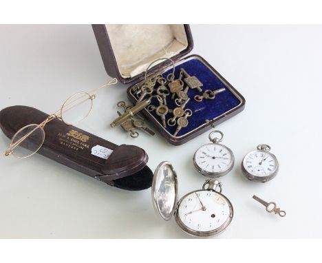 Three Silver cased pocket watches to include a Georgian full hunter fusee, a box of vintage pocket watch keys and a cased pai