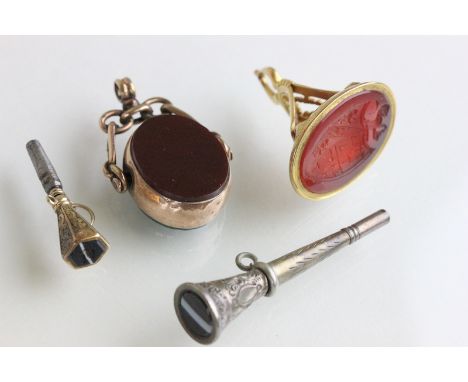 Rose Gold spinning pocket watch fob, a Gold fob with intaglio agate seal, a Silver watch key and a Gold watch key, both with 