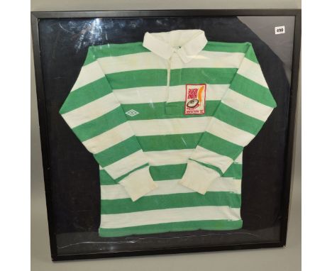 FRAMED UMBRO GREEN AND WHITE STRIPED RUGBY SHIRT, with the Rugby Union Writers Club invitation XV logo patch sown on to the f