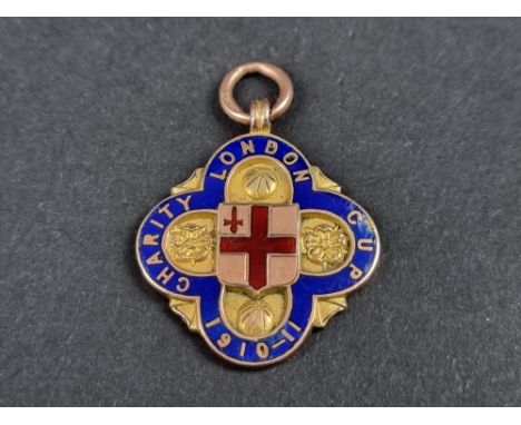 A rare 9ct gold and enamel Nunhead FC football medal, circa 1911,&nbsp;inscribed&nbsp;'London Charity Cup', 26mm high excludi