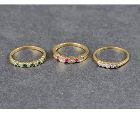 An 18ct gold ring,&nbsp;set six emeralds interspersed with five diamonds, size Q, gross weight 2.4g; together with a yellow m