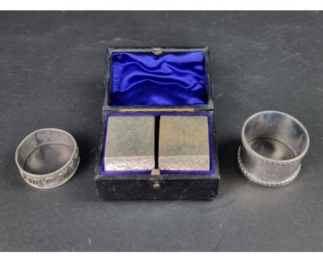 A cased pair of Victorian silver napkin rings, by&nbsp;Atkin Brothers, Sheffield 1892; together with another silver napkin ri