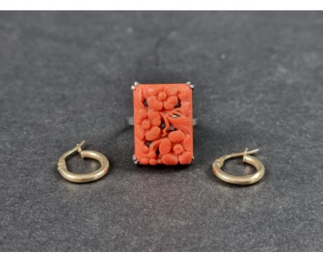 A coral ring, stamped 18ct, size M 1/2; together with a pair of hoop earrings, stamped 375. (3) 