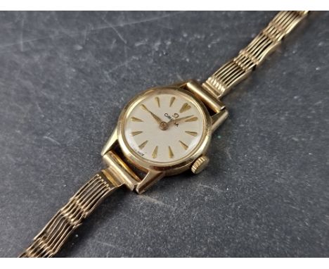 A vintage Omega 14ct gold manual wind ladies wristwatch, 19mm, Cal. 244, on 9ct gold W. H. Wilmot bracelet. 