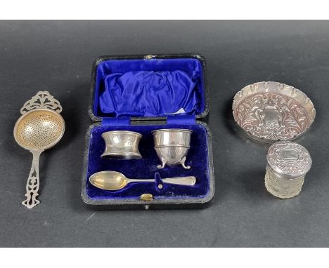 A cased Edwardian silver egg cup, spoon and napkin ring, by CJ DF, London 1911; together with a silver dish, by Mappin &amp; 