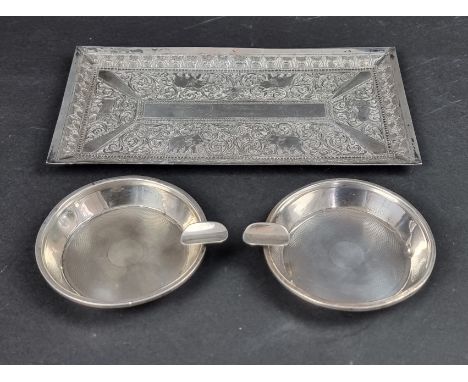 A pair of engine turned silver ashtrays, by G W Lewis &amp; Co, Birmingham 1946, 8cm diameter, 66g; together with an Indian w