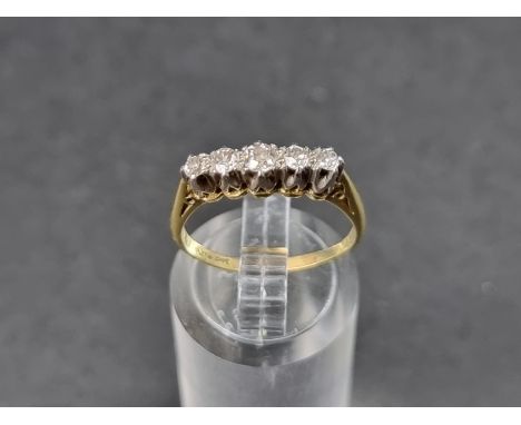 A yellow metal diamond five stone ring, stamped 'Plat &amp; 18ct', size M 1/2. 