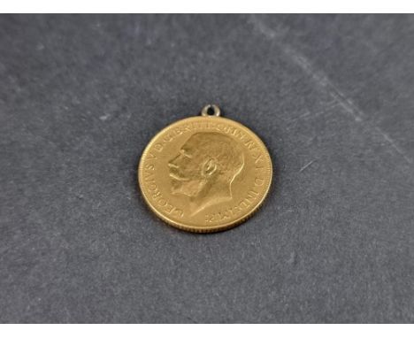 Coins:&nbsp;a George V 1913 gold sovereign, in ring mount. 