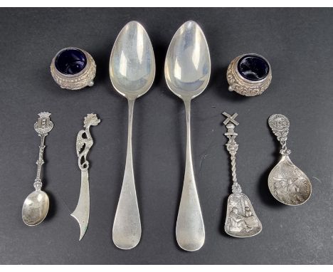 A pair of Indian Karachi-Cutch white metal salts, stamped 'J Manikrai Karachi T95'; together with four other white metal and 