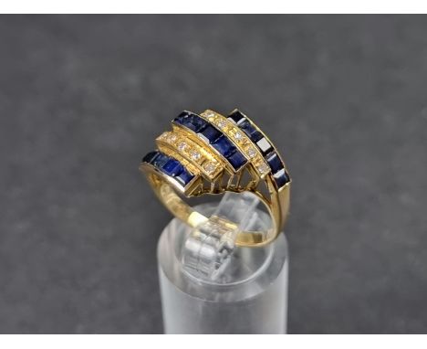 A yellow metal ring, having five rows of pave set sapphires and diamonds, stamped '18k', size N. 