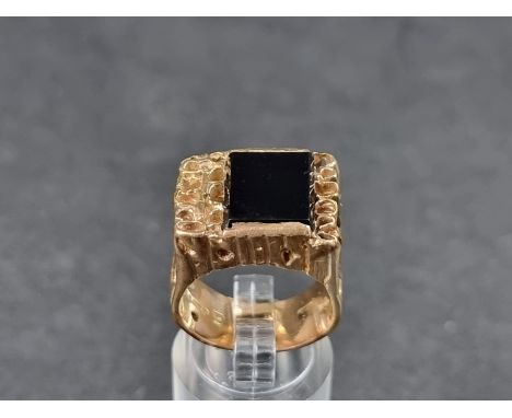 A 9ct gold ring, set black onyx, London 1970, gross weight 12.7g. 