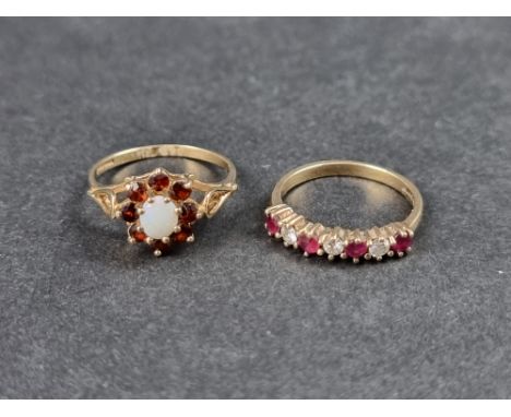 A 9ct gold opal and garnet cluster ring, size K, Birmingham 1991; together with another 9ct gold ring, set rubies and diamond