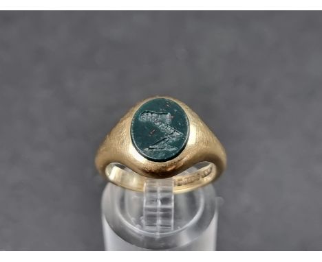 A 9ct gold signet ring, set crested intaglio bloodstone, Birmingham 1991, size M, gross weight 5.8g. 
