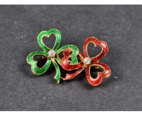 A yellow metal diamond set and guilloche enamel brooch, formed as conjoined love heart ribbons, 33mm wide. 