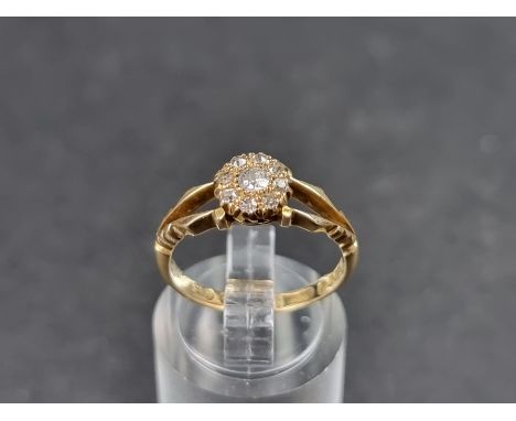 An Edwardian 18ct gold diamond cluster ring, set nine old cut diamonds, Sheffield 1909, size M, gross weight 2.9g. 
