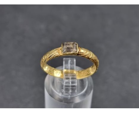 A George II yellow metal memorial ring, set faceted crystal, inscribed 'Jno Shepherd, Obt 20 Jan 1724, aet 62', size O. 