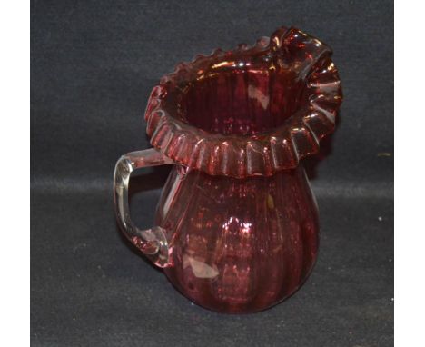 A Large Ruby Glass Jug