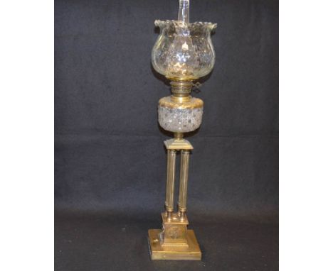An Unusual Four Pillar Brass Based Oil Lamp and Shade 