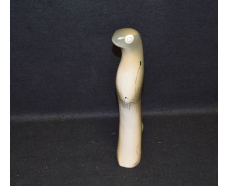A Royal Dux Bohemian Otter and a Tall Glass Decanter 
