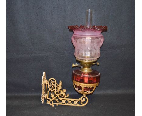 A Ruby Glass Oil Lamp, Ruby Shade on Gilted Metal Wall Bracket 