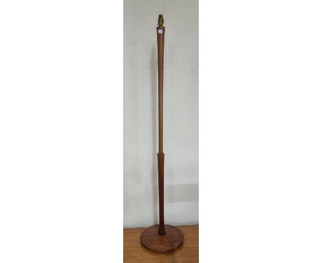 A teak standard lamp 