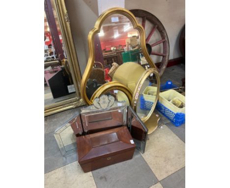 Three gilt framed mirrors, a Venetian style mfolding dressing mirror and a mahogany sarcophagus shaped tea caddy 