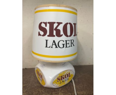 A porcelain Skol Lager advertising lamp 