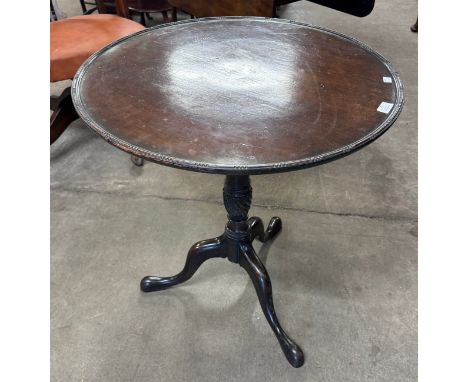 A George III Chippendale style mahogany circular tilt top tripod tea table 
