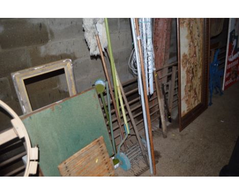 A quantity of long handle gardening tools; a rotary washing line etc