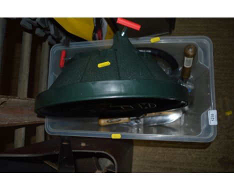 A box of various gardening tools