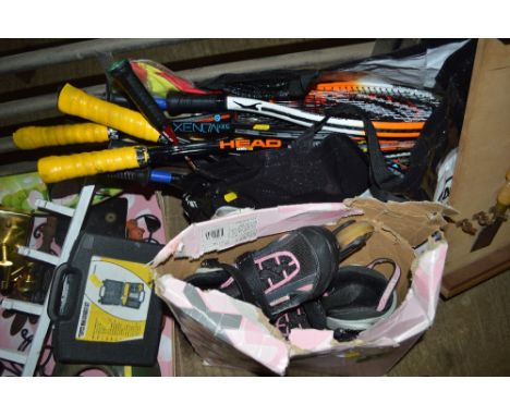 A bag of various tennis rackets and badminton rackets etc; and a pair of roller blades