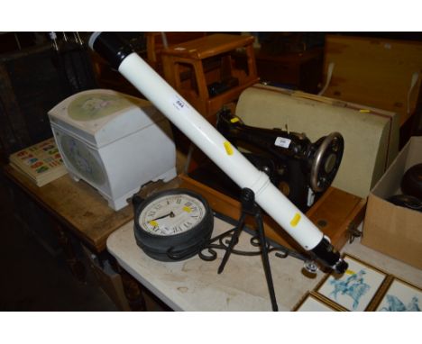 A small Folus telescope on tripod base 