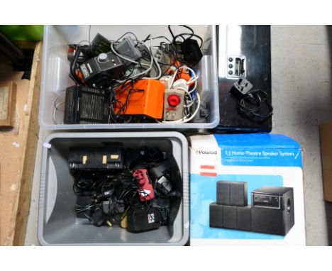 Various chargers, controllers and similar, a speaker dock and boxed Polaroid 5.1 Home Theatre System. [4] [SW]