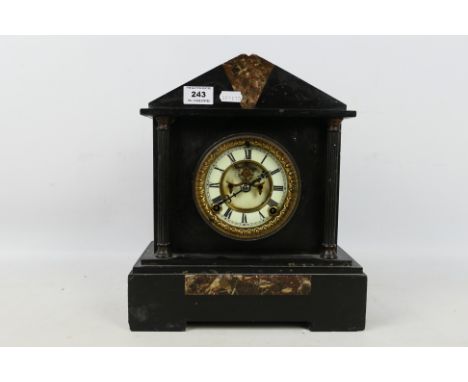 A late 19th or early 20th century black marble cased mantel clock by Ansonia, the case of architectural form, embellished wit