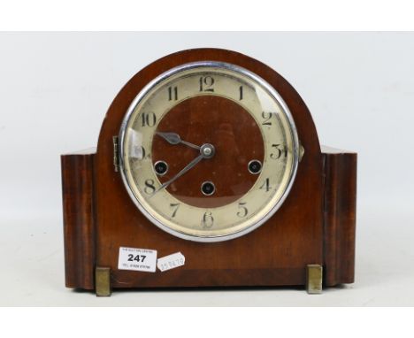 An Art Deco styled oak cased Westminster chiming mantel clock, opening chrome bezel, applied silvered chapter ring with Arabi