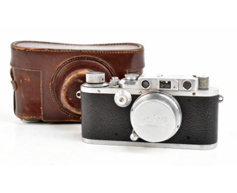 LEICA; a model IIIA camera, number 292741, with an Ernst Leitz Wetzlar Summar F=5cm lens, number 404460, with leather case.Ad