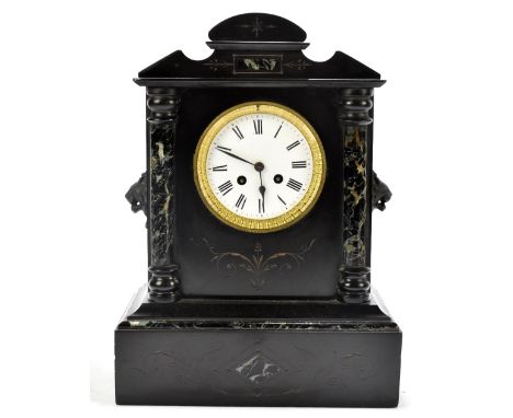 A 19th century black slate eight day mantel clock, the enamel dial with Roman numerals and movement striking on a bell, in ar