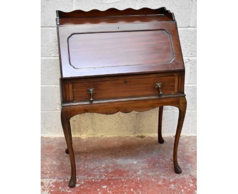 A 1920s mahogany bureau with 3/4 serpentine gallery above a panelled fall, over a long drawer, on cabriole legs and pad feet,