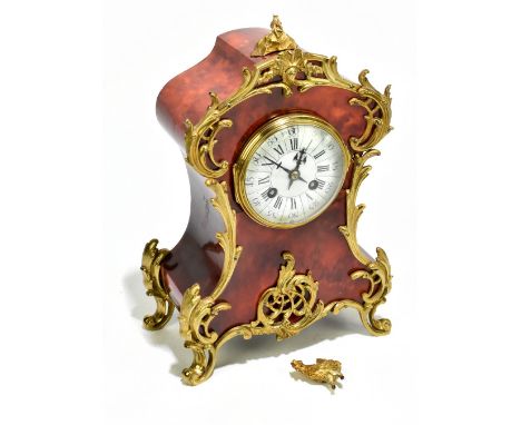 A Louis XV style gilt metal mounted tortoiseshell eight day mantel clock, with enamel Roman numeral dial and movement strikin