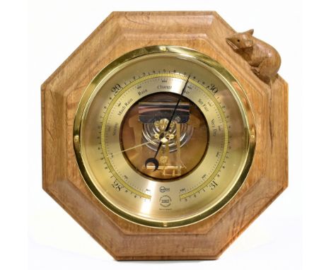 ROBERT 'MOUSEMAN' THOMPSON; a carved oak octagonal barometer, with brass Barigo dial, diameter 20cm.Additional InformationMin