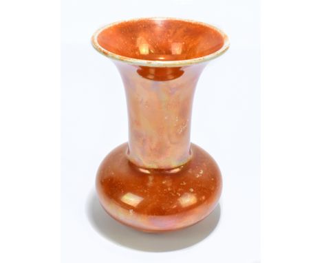 RUSKIN; a baluster shaped orange lustre vase, impressed marks and dated 1916 to the underside, height 15.5cm.Additional Infor