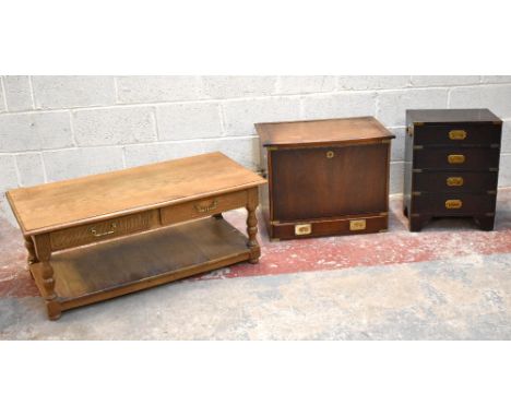 A reproduction light oak coffee table of rectangular form, with four drawers above undertier magazine shelf, width 111cm, dep