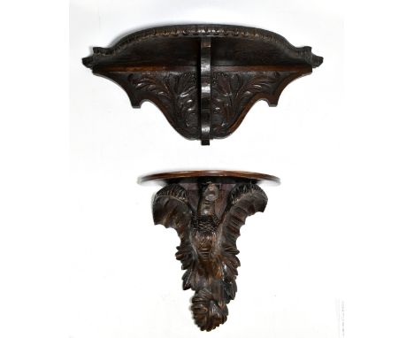 Two carved wood wall brackets, the first carved and stained pine example modelled as a dragon with semicircular mahogany top,