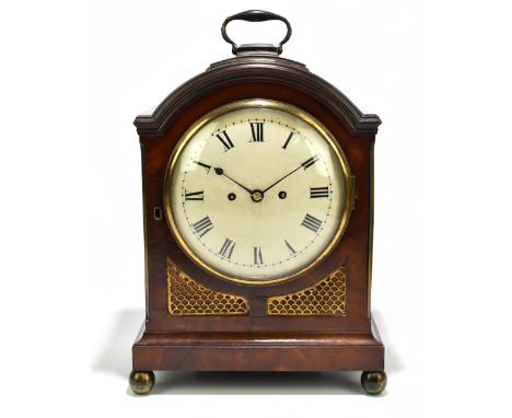 An early 19th century mahogany bracket clock with brass carry handle, eight day fusee movement, with pierced gilt brass inset