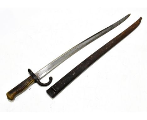 A French 1866 pattern chassepot bayonet, the 57.5cm serpentine blade engraved to the back Mre D'armes de St-Etienne 8 Bre 187