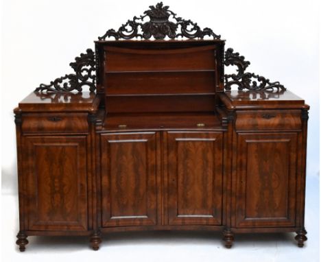 A 19th century French mahogany inverted breakfront mirrored back server/sideboard, the central mirrored back with carved flor