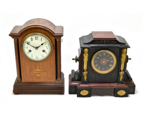 A Victorian black slate and rouge marble mantel clock of architectural form, in the Aesthetic Movement style with applied gil